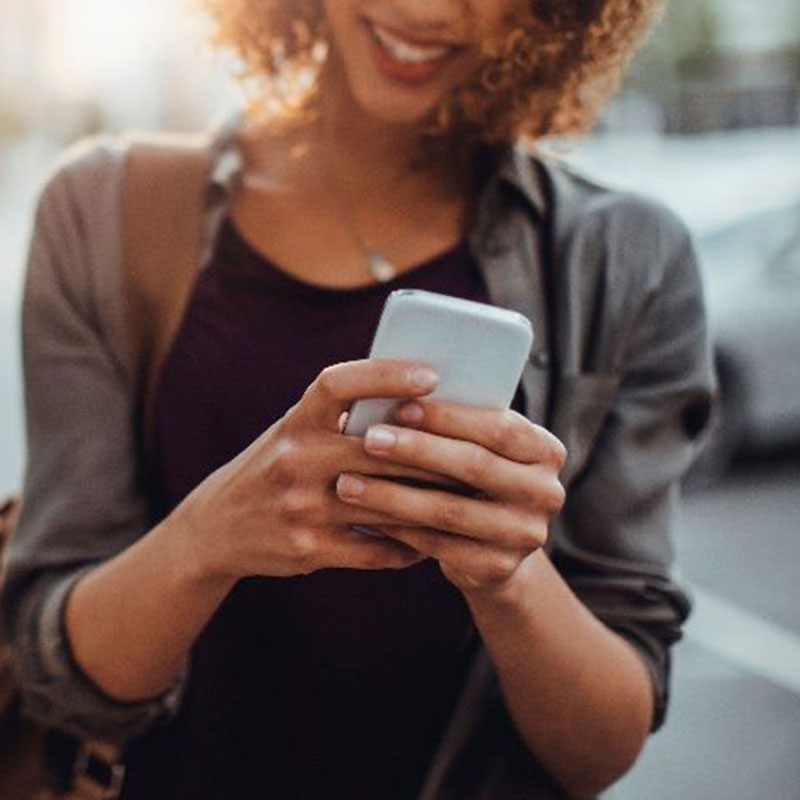 Lady using iPhone on street
