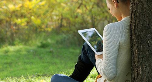 Lady in park with iPad