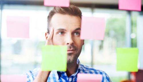 Man reading post-it notes