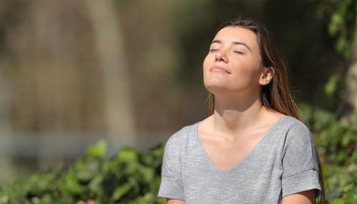 Lady meditating outdoors