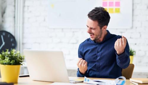 Happy man at desk